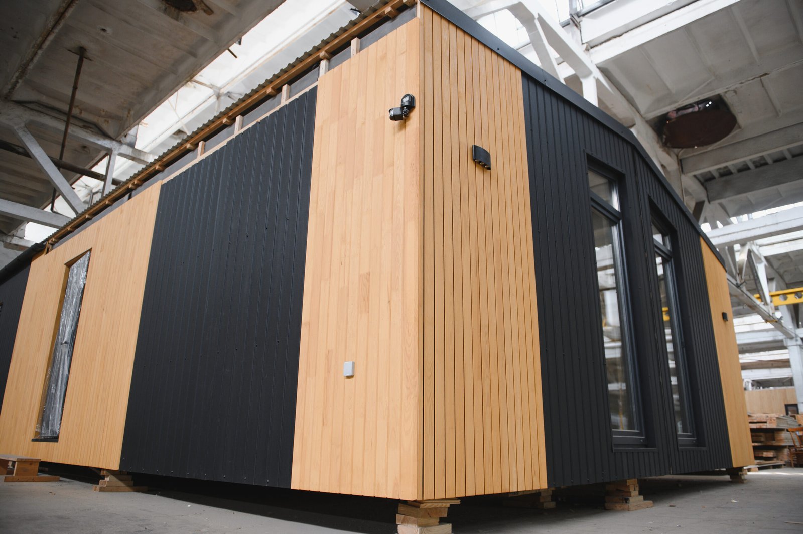 Production of new wooden modular houses. Construction site.